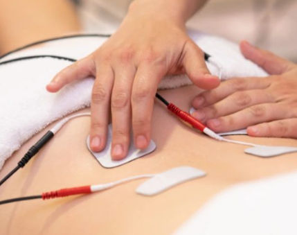EMS muscle stimulation treatment at Unique Boutique Your Day of Beauty in Newton Centre, MA